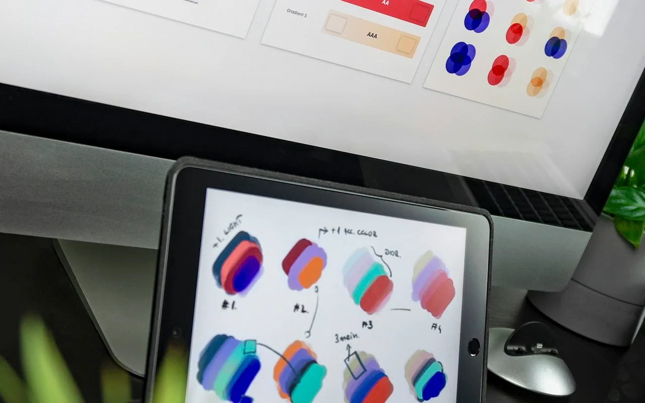 Product designer reviewing UI layouts and interface patterns